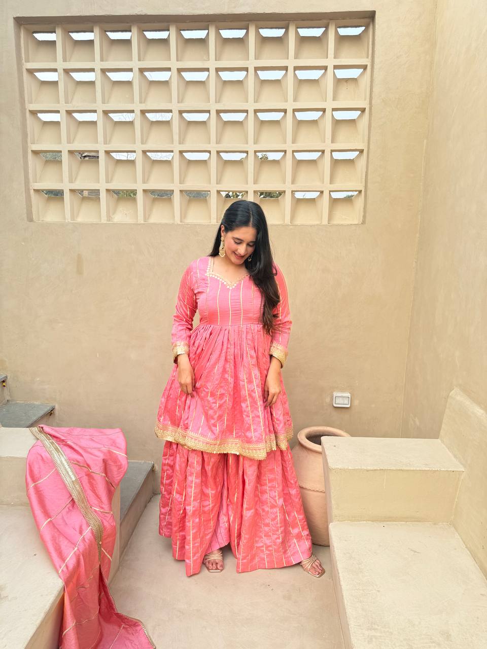 Radiant Rose Pink Flared Peplum Kurti and Sharara Set Embellished with Luminous Gold Zari Stripes and Sequined Borders